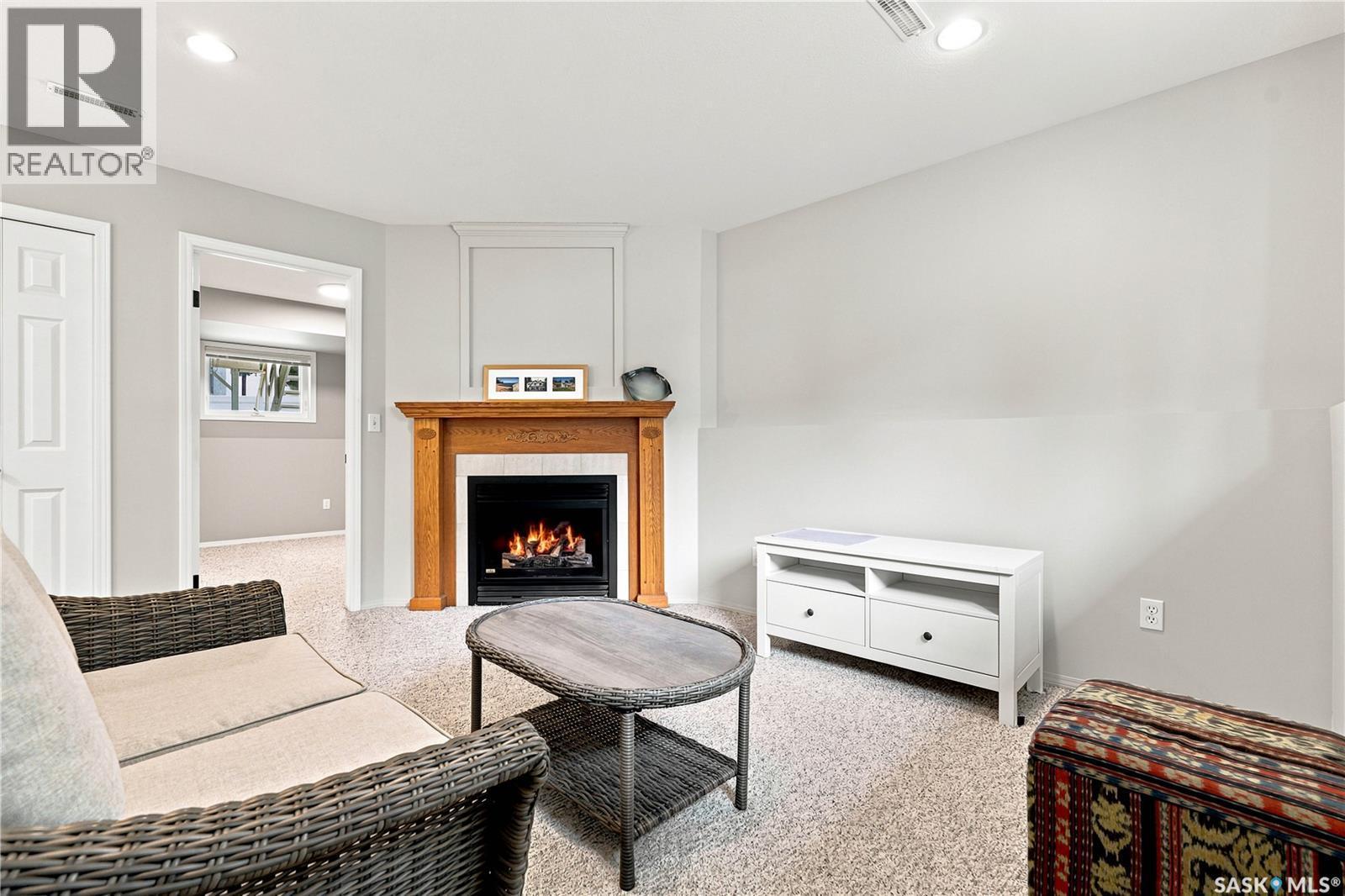 11 605 Perehudoff Crescent, Saskatoon, SK - Indoor Photo Showing Living Room With Fireplace