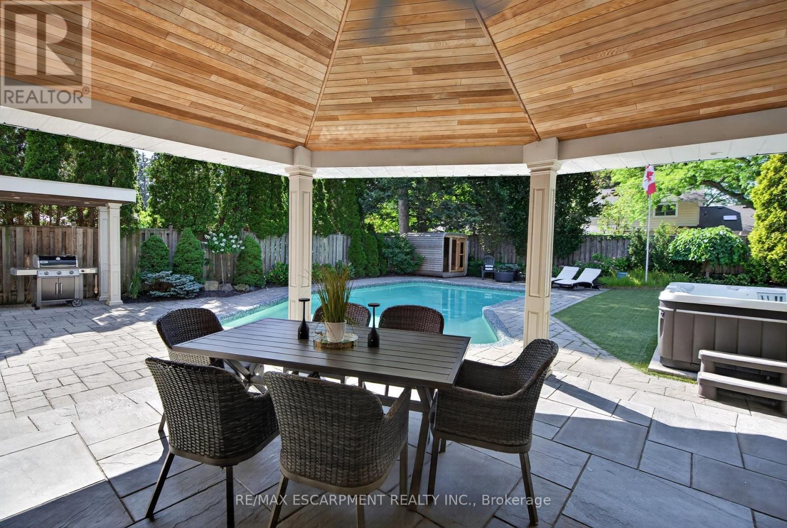 Covered rear patio - 4461 Tremineer Avenue, Burlington, ON - Outdoor With In Ground Pool With Deck Patio Veranda With Exterior