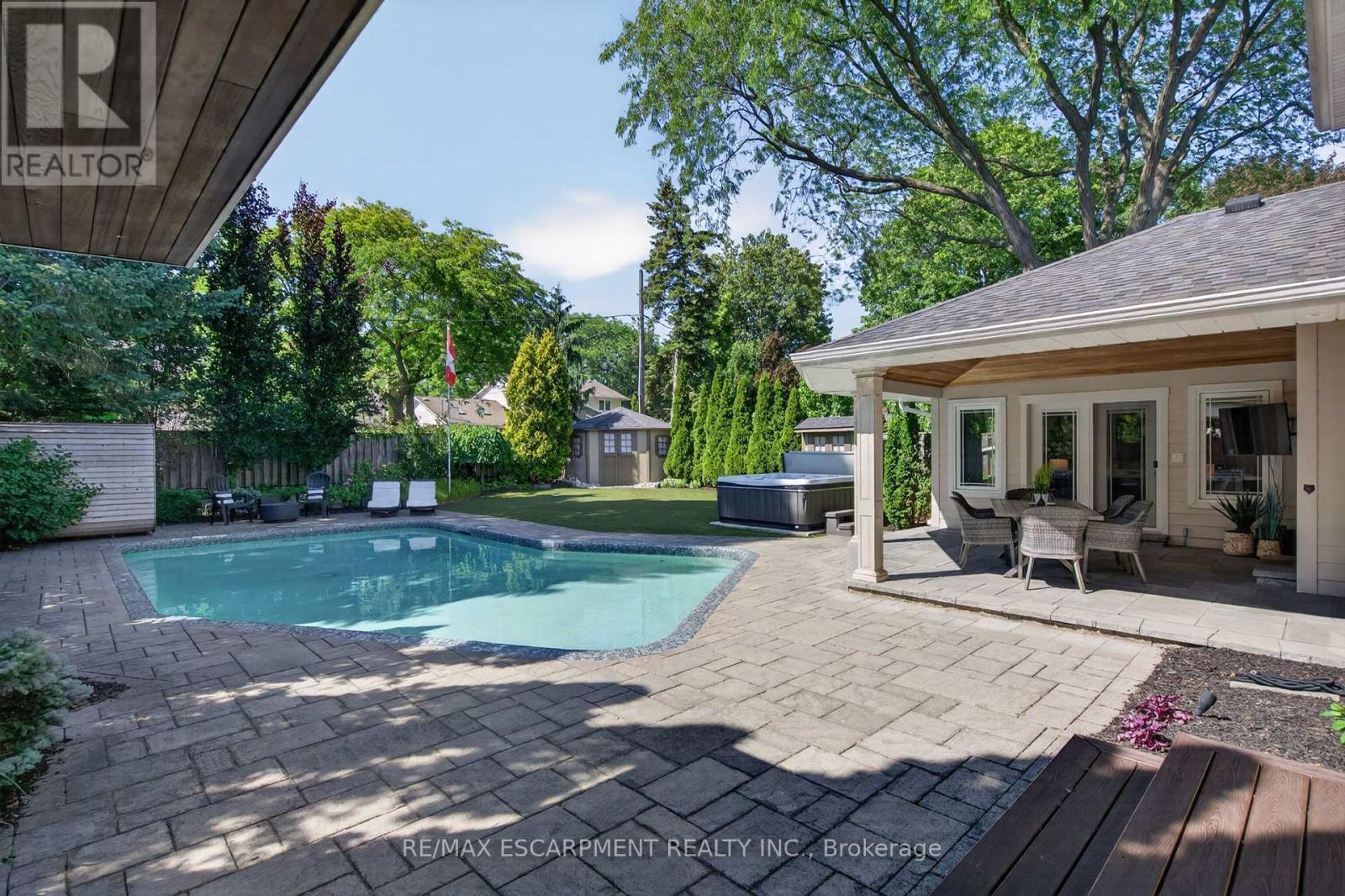 Soak it all in - 4461 Tremineer Avenue, Burlington, ON - Outdoor With In Ground Pool With Deck Patio Veranda