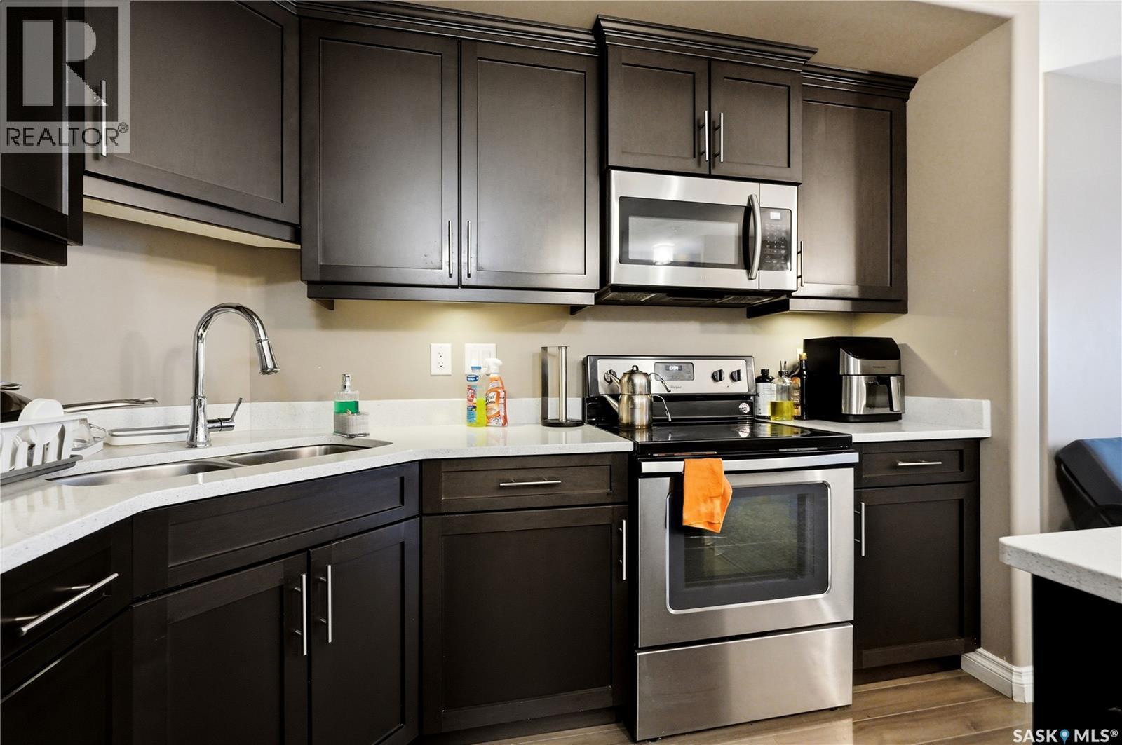 210 423 Nelson Road, Saskatoon, SK - Indoor Photo Showing Kitchen With Double Sink With Upgraded Kitchen