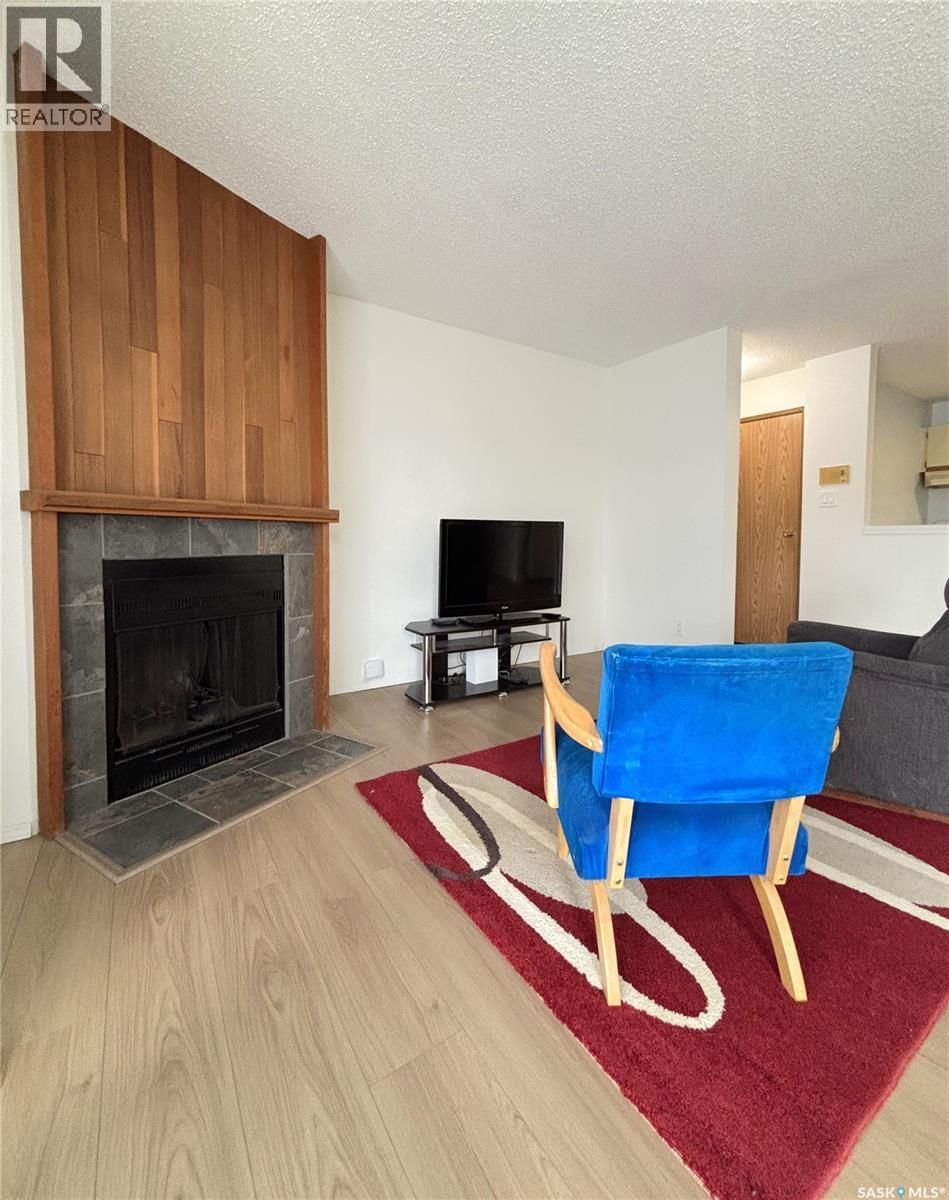 202 - 385 Kingsmere Boulevard, Saskatoon, SK - Indoor Photo Showing Living Room With Fireplace