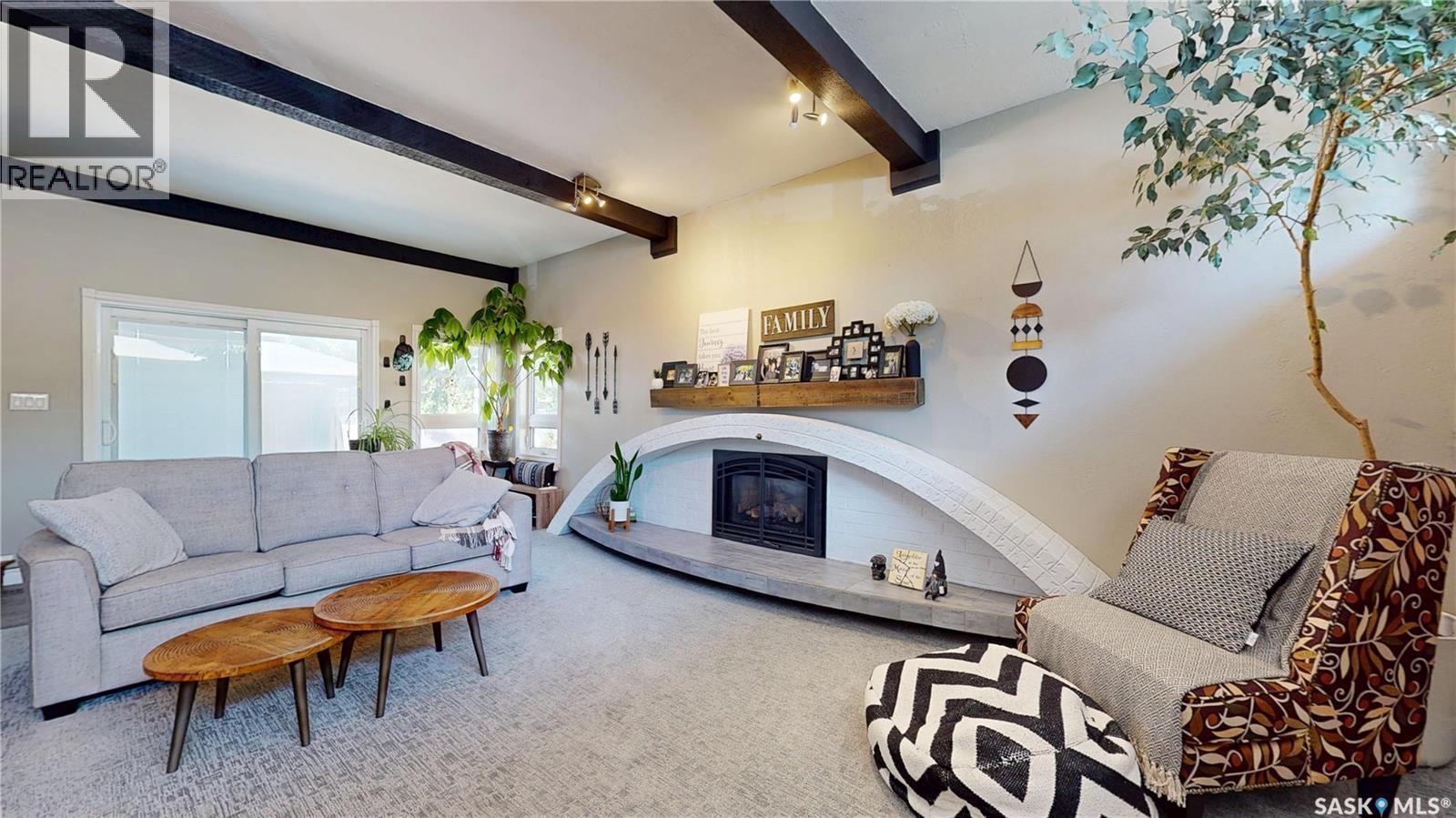 30 Rosewood Place, Regina, SK - Indoor Photo Showing Living Room With Fireplace
