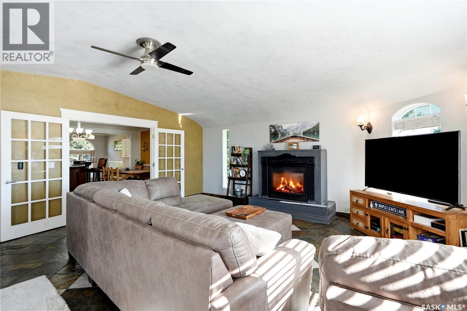308 3Rd Street W, Delisle, SK - Indoor Photo Showing Living Room With Fireplace