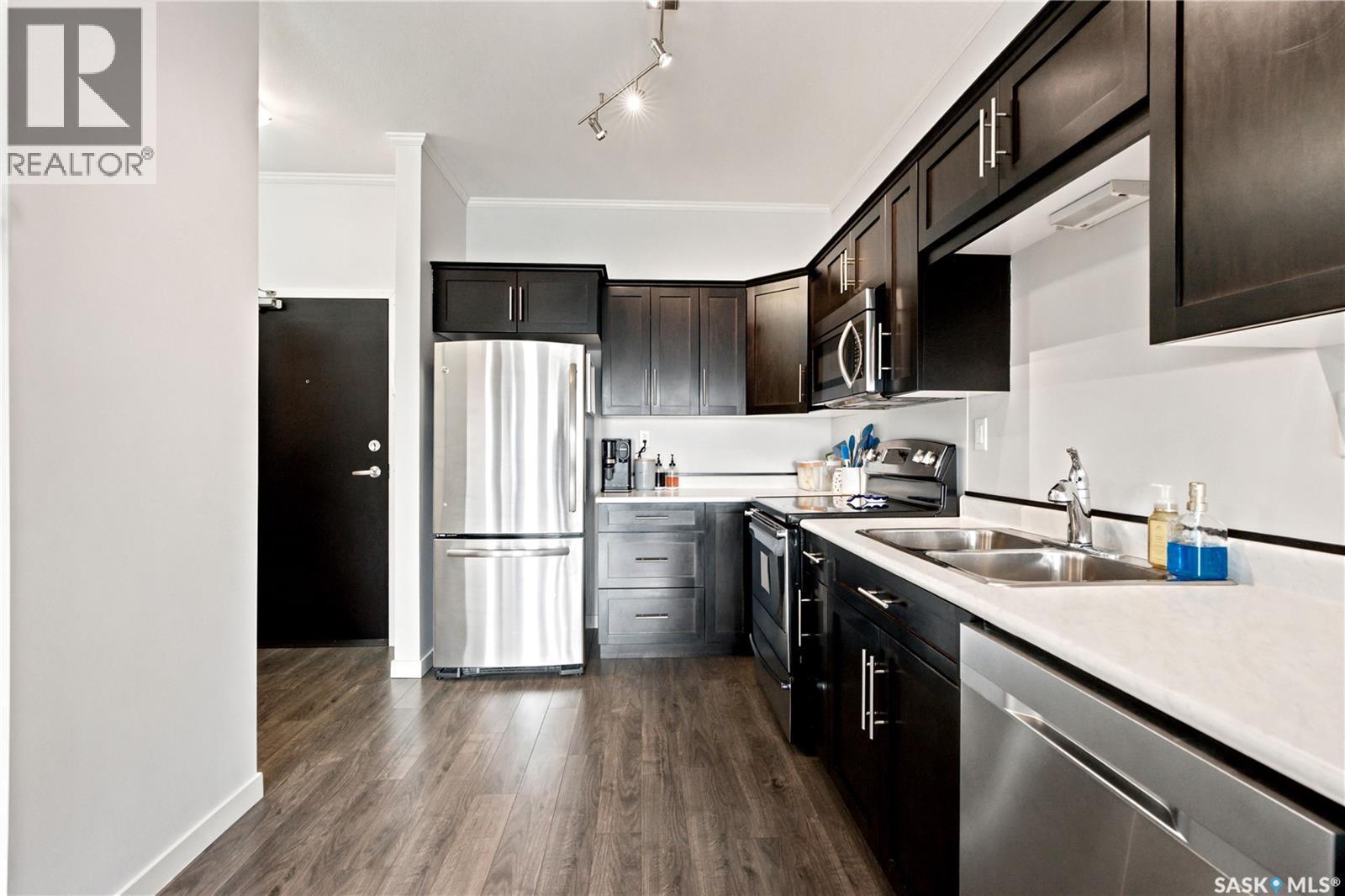 214 545 Hassard Close, Saskatoon, SK - Indoor Photo Showing Kitchen With Stainless Steel Kitchen With Double Sink