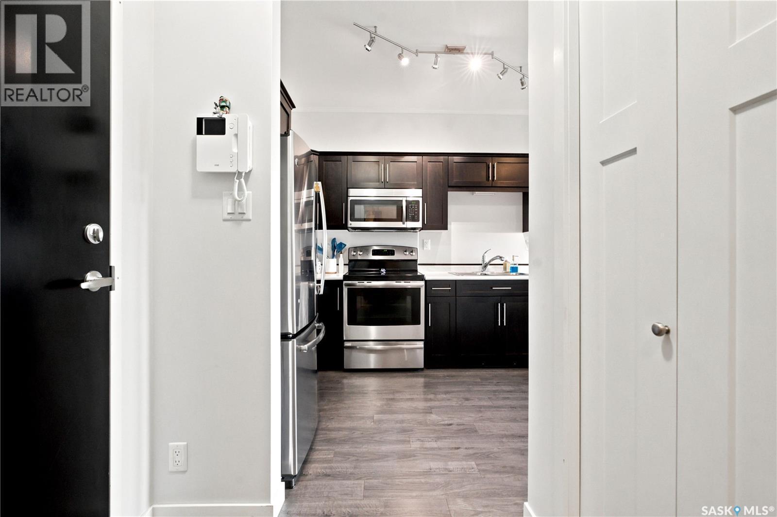 214 545 Hassard Close, Saskatoon, SK - Indoor Photo Showing Kitchen With Stainless Steel Kitchen With Double Sink