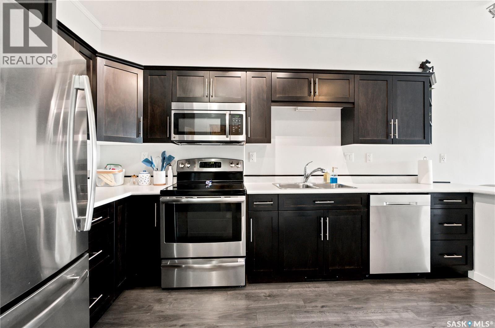 214 545 Hassard Close, Saskatoon, SK - Indoor Photo Showing Kitchen With Stainless Steel Kitchen With Double Sink