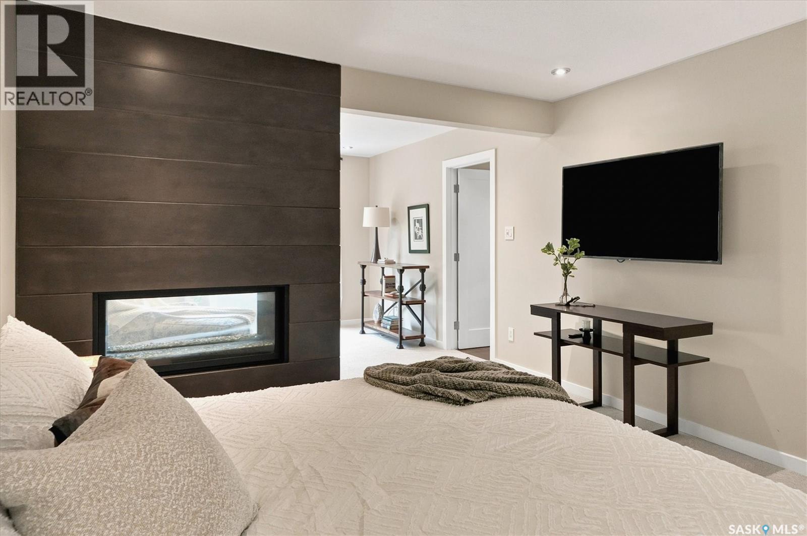 3834 Balfour Place, Saskatoon, SK - Indoor Photo Showing Bedroom With Fireplace