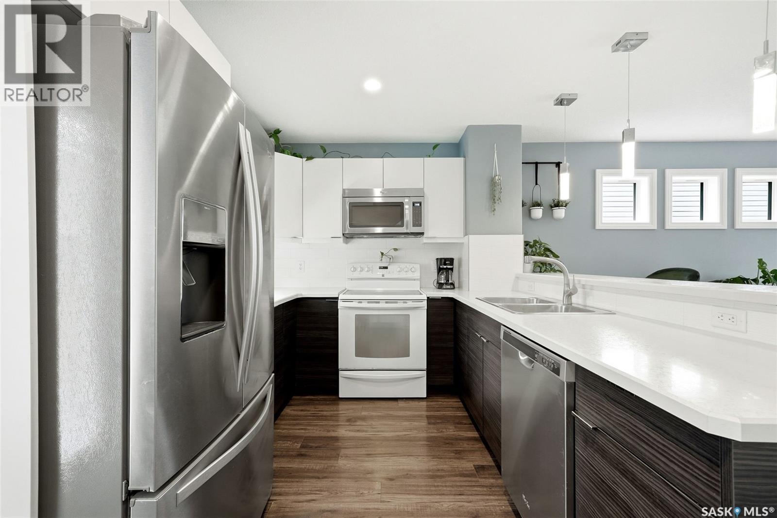 143 1920 7Th Avenue E, Regina, SK - Indoor Photo Showing Kitchen With Stainless Steel Kitchen With Double Sink