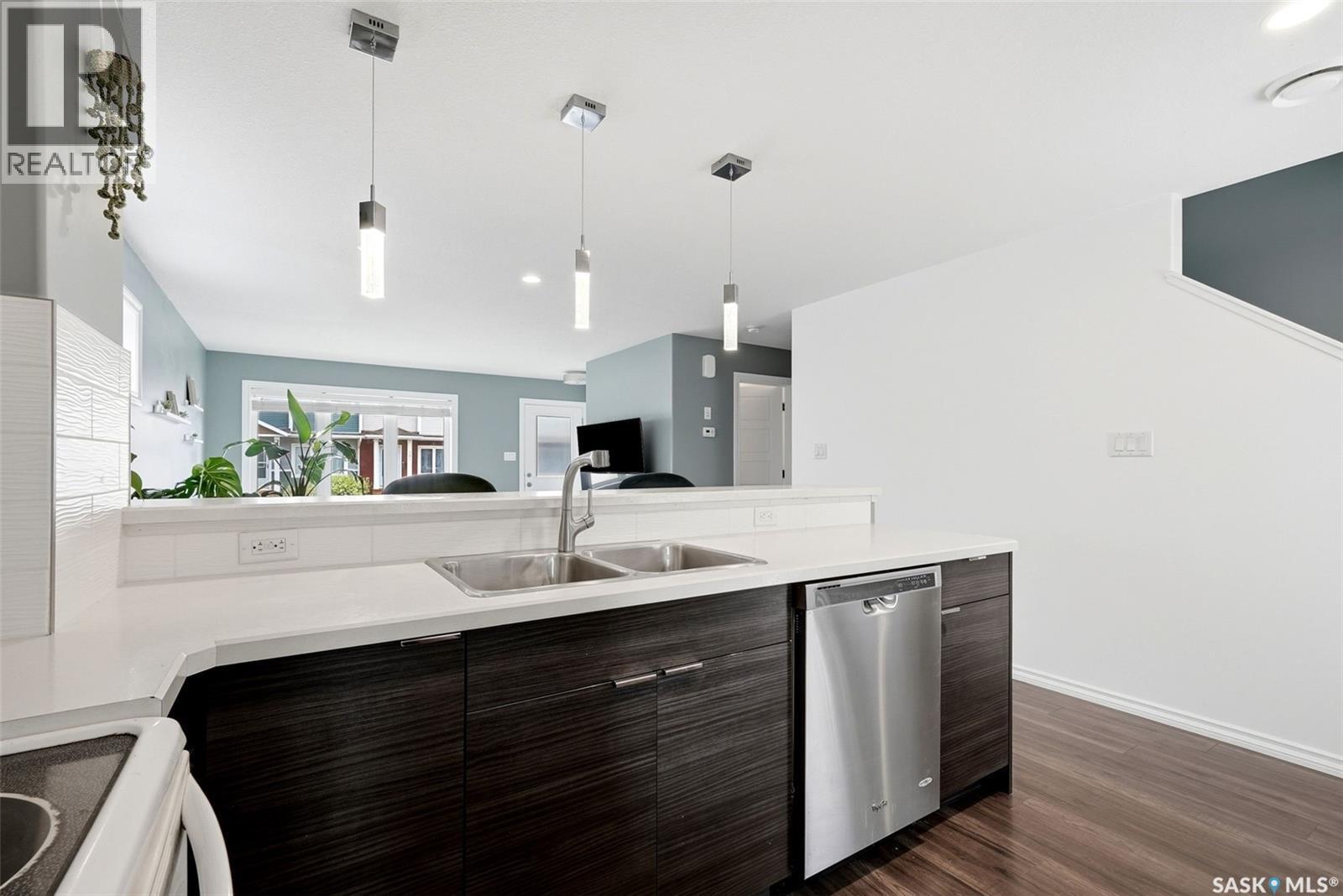 143 1920 7Th Avenue E, Regina, SK - Indoor Photo Showing Kitchen With Double Sink