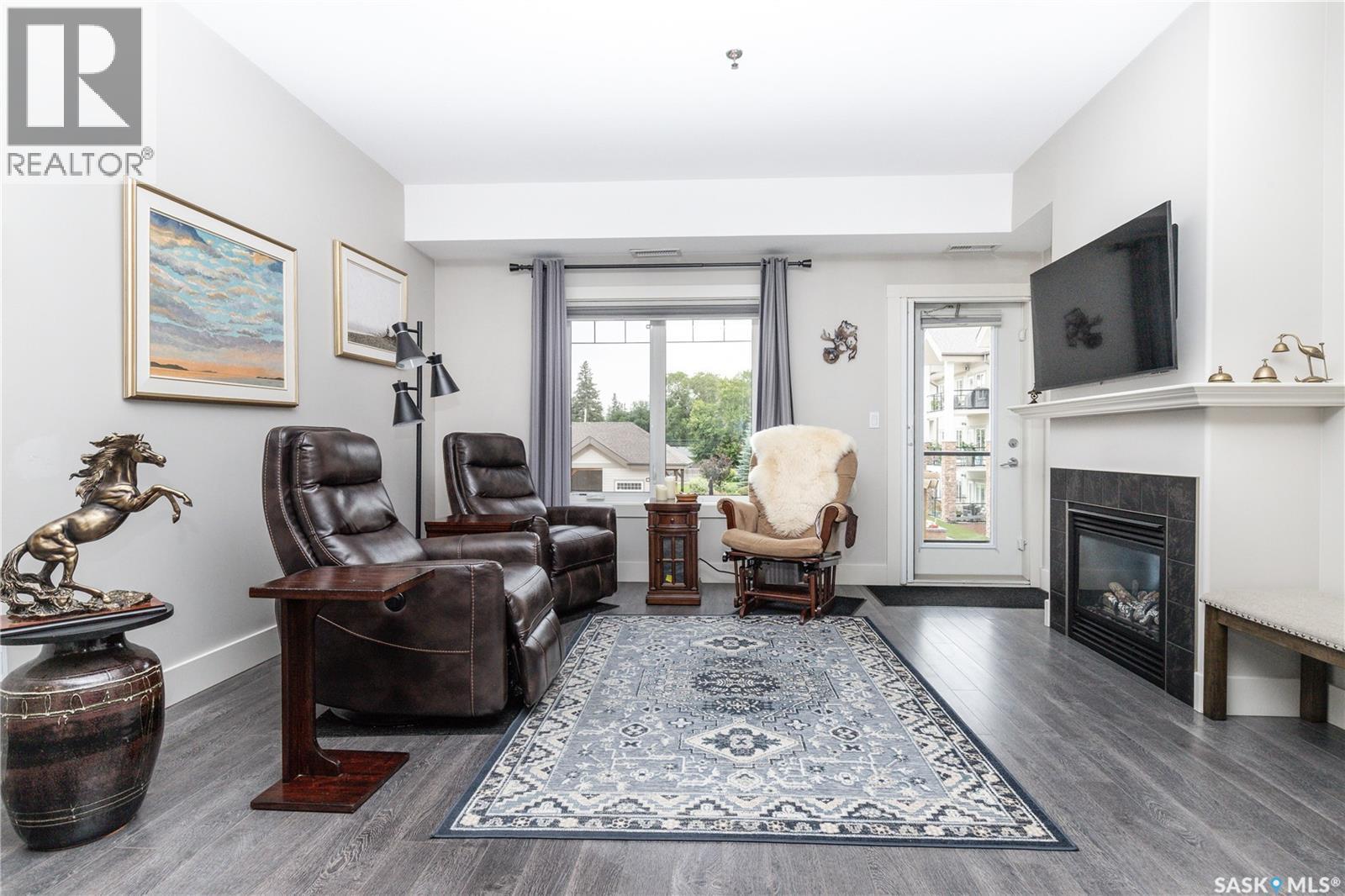 217 1010 Ruth Street E, Saskatoon, SK - Indoor Photo Showing Living Room With Fireplace