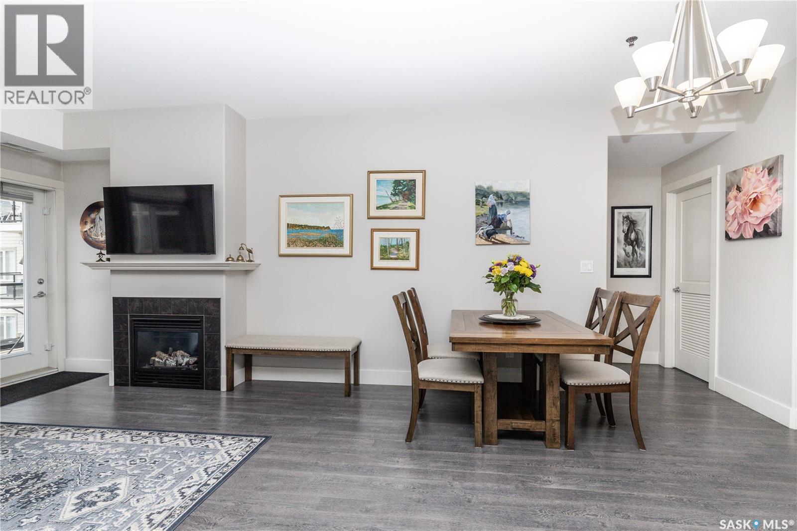 217 1010 Ruth Street E, Saskatoon, SK - Indoor Photo Showing Other Room With Fireplace