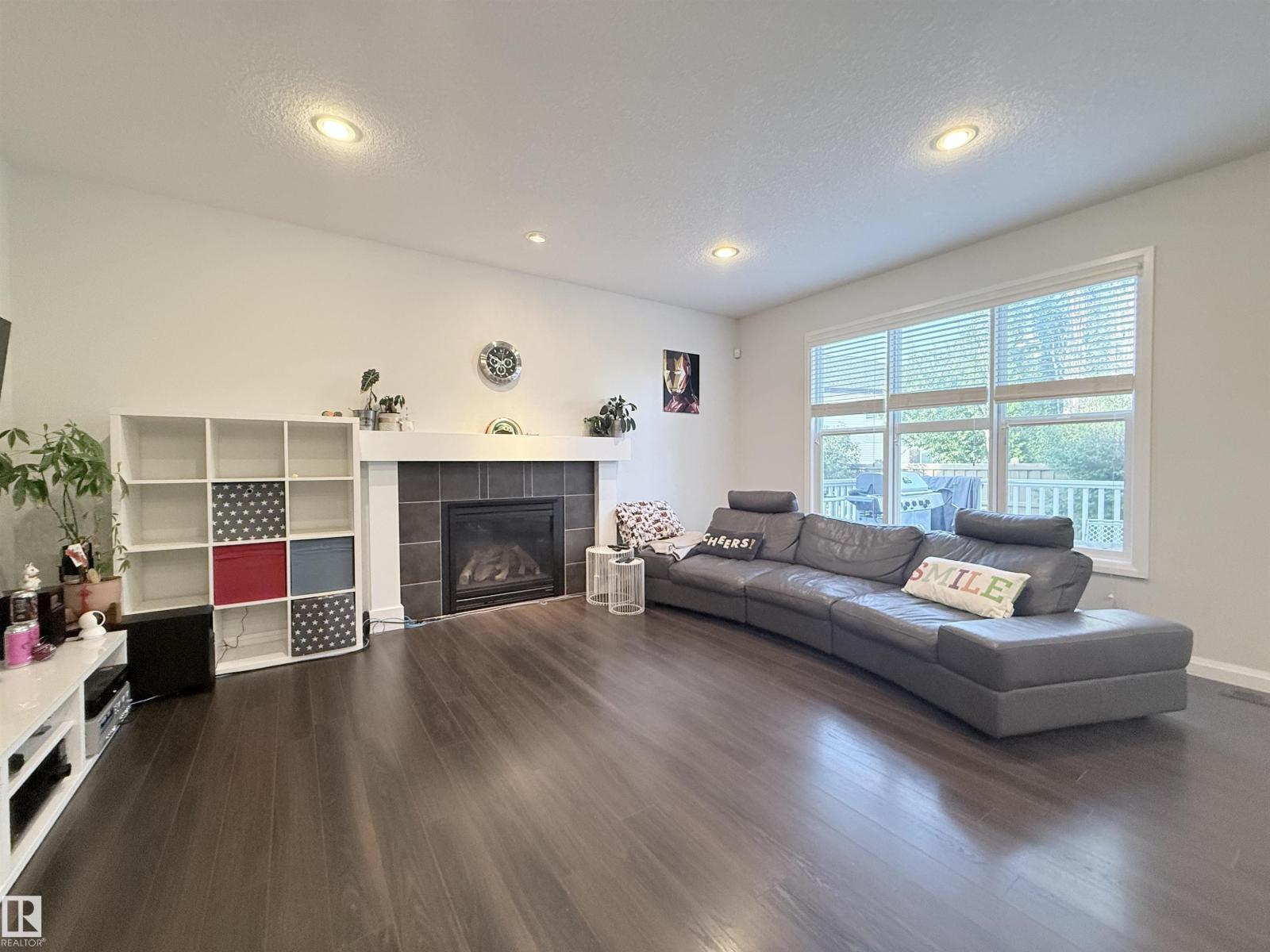 5876 168 Av Nw, Edmonton, AB - Indoor Photo Showing Living Room With Fireplace