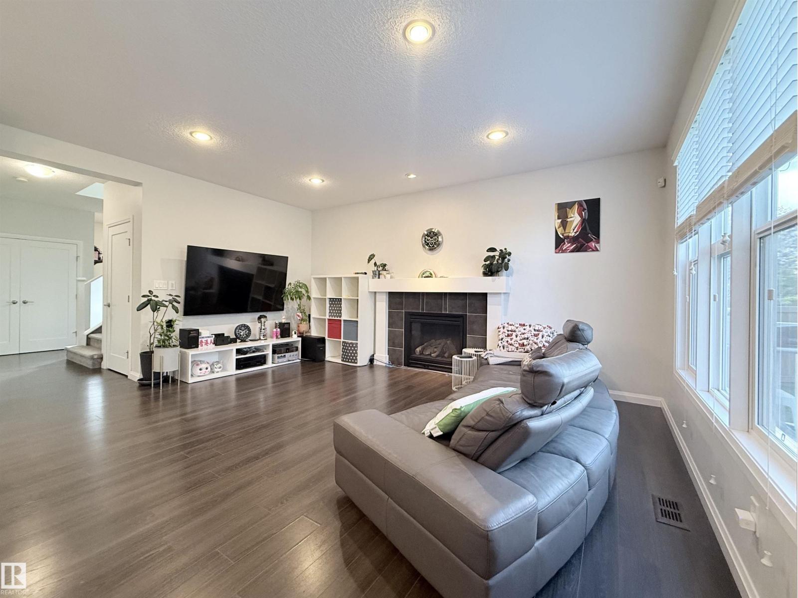 5876 168 Av Nw, Edmonton, AB - Indoor Photo Showing Living Room With Fireplace