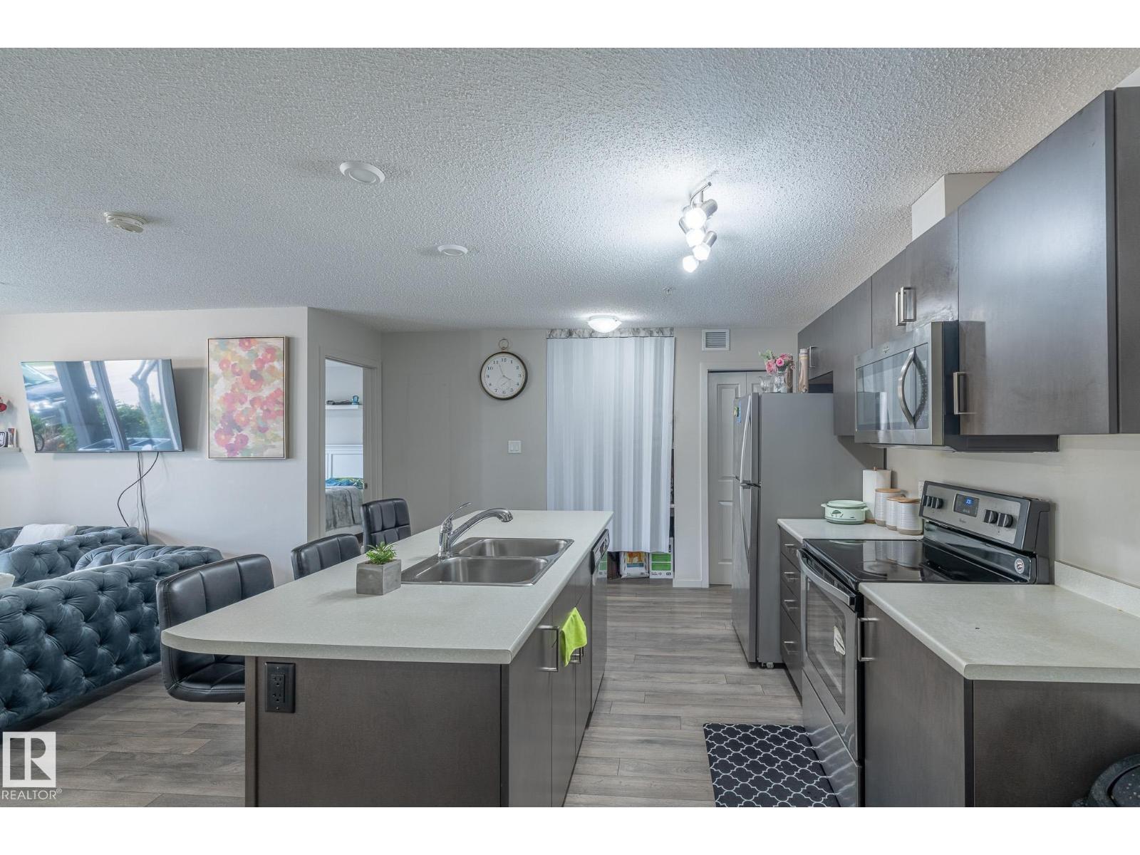 #107 142 Ebbers Bv Nw, Edmonton, AB - Indoor Photo Showing Kitchen With Double Sink With Upgraded Kitchen