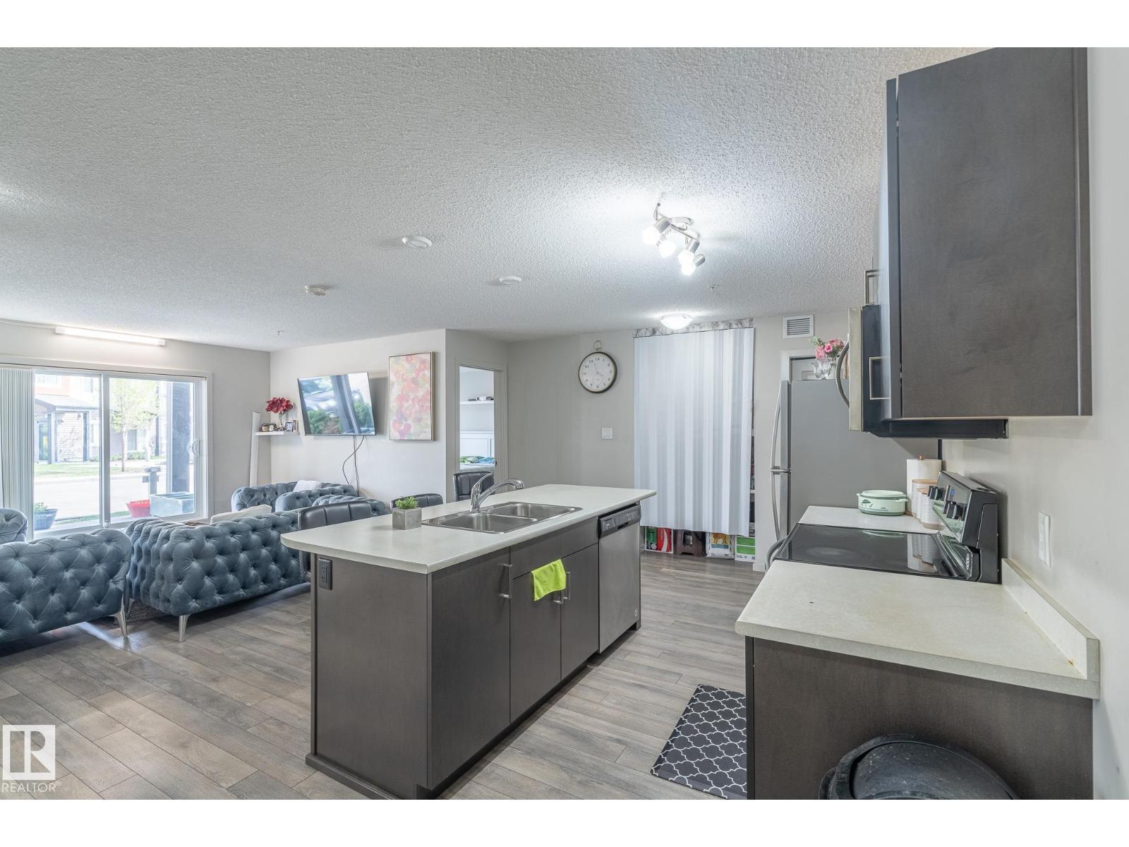 #107 142 Ebbers Bv Nw, Edmonton, AB - Indoor Photo Showing Kitchen With Double Sink