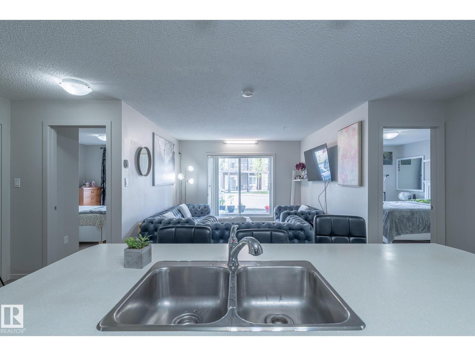 #107 142 Ebbers Bv Nw, Edmonton, AB - Indoor Photo Showing Kitchen With Double Sink