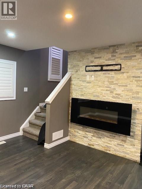 4 Isaiah Drive, Kitchener, ON - Indoor Photo Showing Other Room With Fireplace