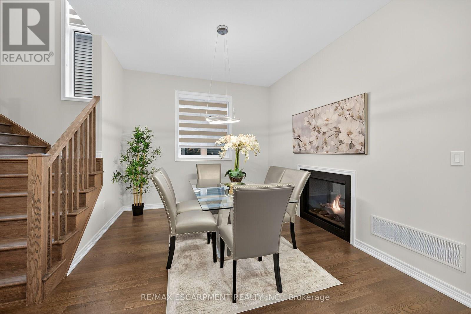 67 Starfire Crescent, Hamilton, ON - Indoor Photo Showing Dining Room With Fireplace