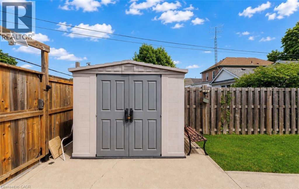 Exterior storage shed with double gray doors - 237 Paling Avenue, Hamilton, ON - Outdoor