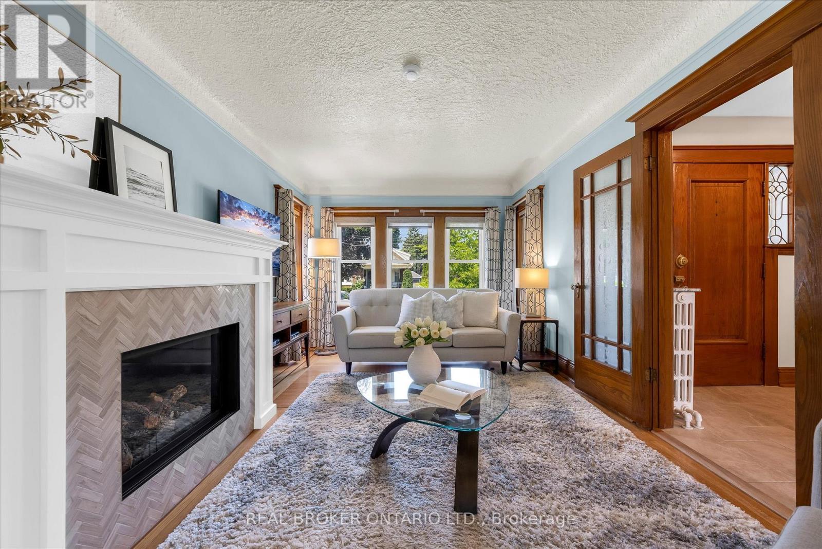 99 Tuxedo Avenue S, Hamilton, ON - Indoor Photo Showing Living Room With Fireplace