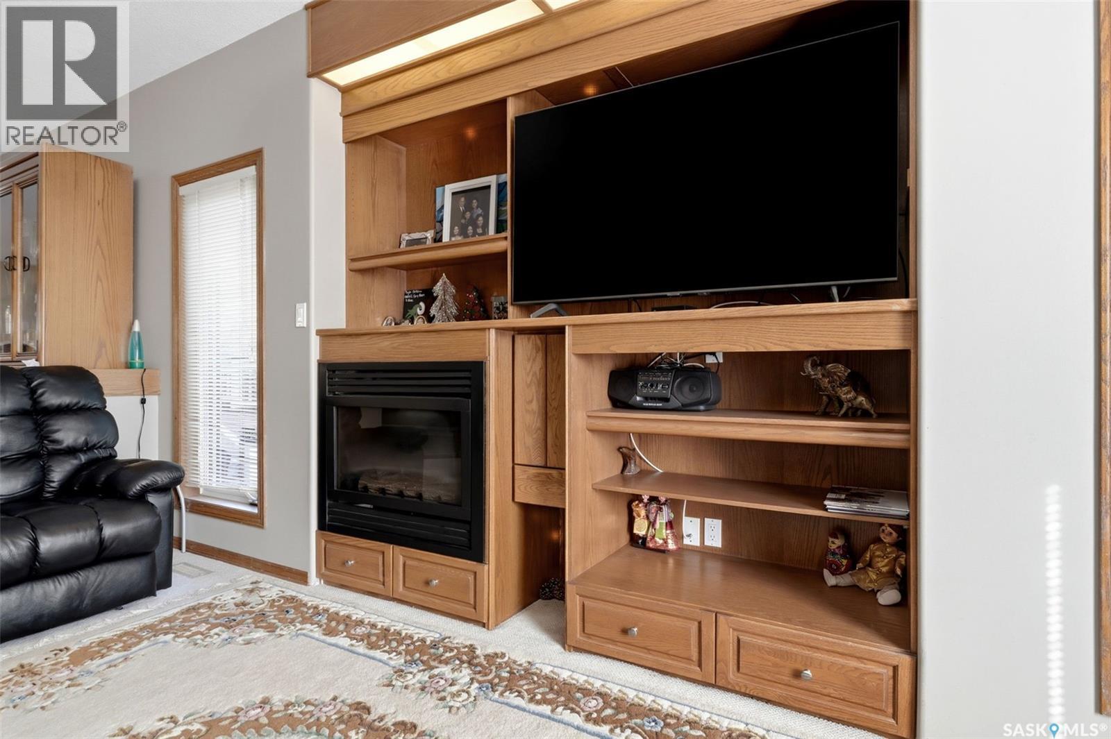 2135 Potts Crescent E, Regina, SK - Indoor Photo Showing Other Room With Fireplace