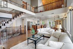 Living Room with view to Family Room above and Kit -