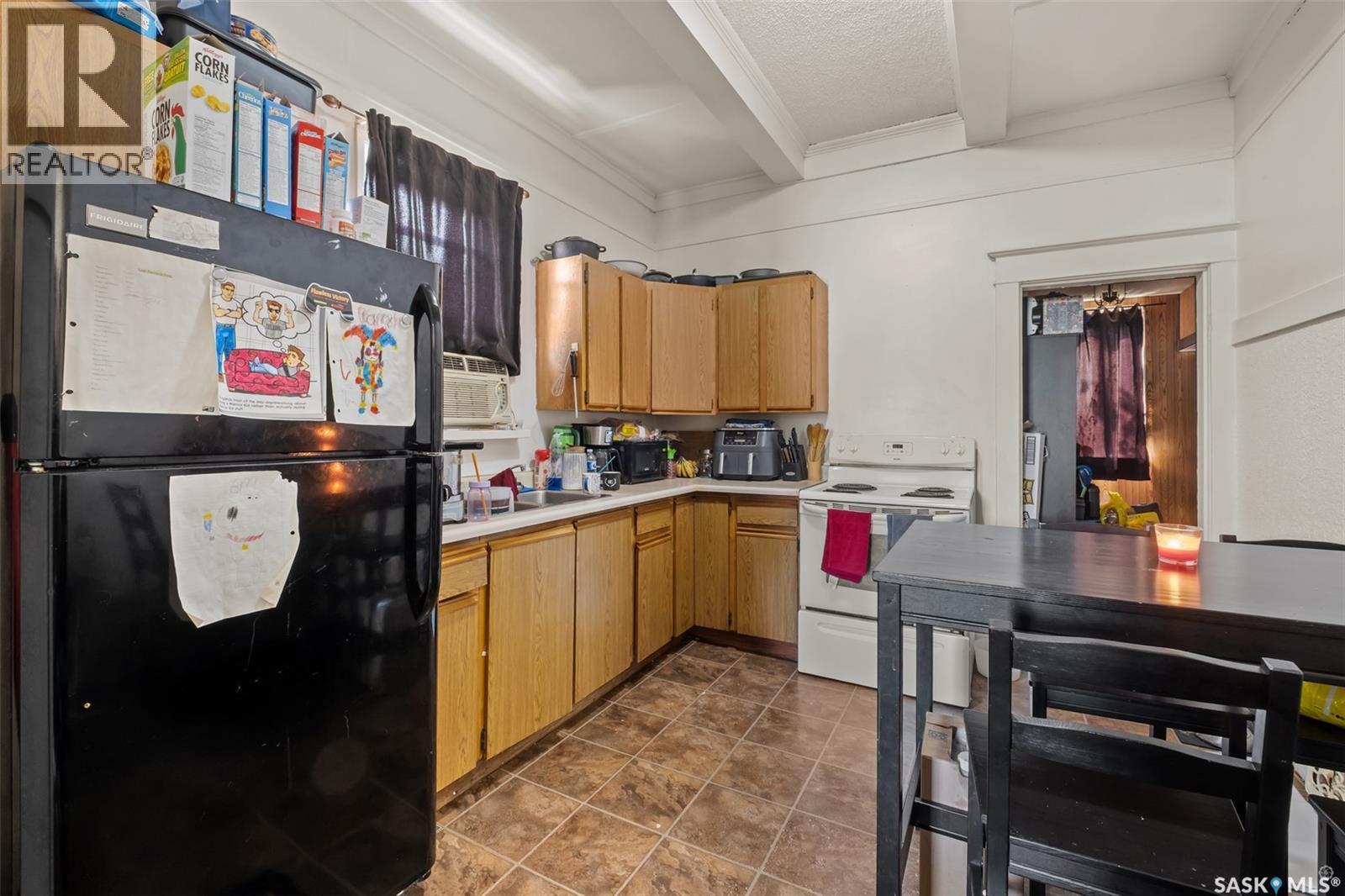1313 6Th Avenue W, Prince Albert, SK - Indoor Photo Showing Kitchen With Double Sink