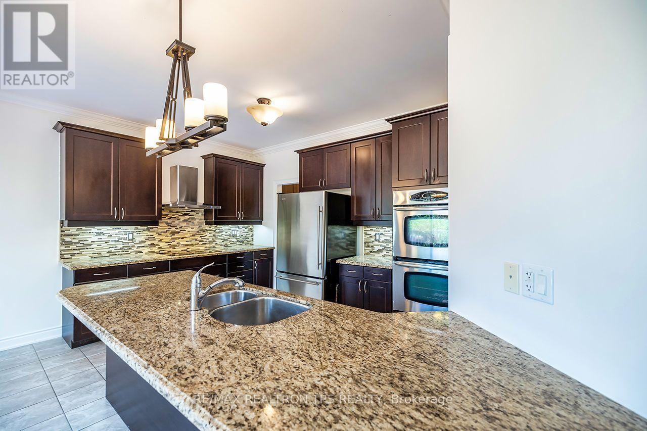 Spacious Kitchen with Large Island - 555 Kingsfield Loop, Oshawa, ON - Indoor Photo Showing Kitchen With Stainless Steel Kitchen With Double Sink