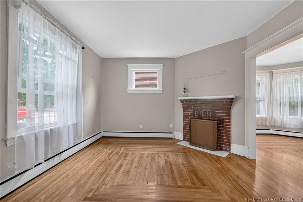 298-300 Cameron St, Moncton, NB - Indoor Photo Showing Other Room With Fireplace