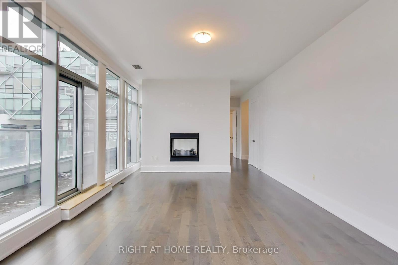 1126 - 39 Queens Quay E, Toronto, ON - Indoor Photo Showing Other Room With Fireplace