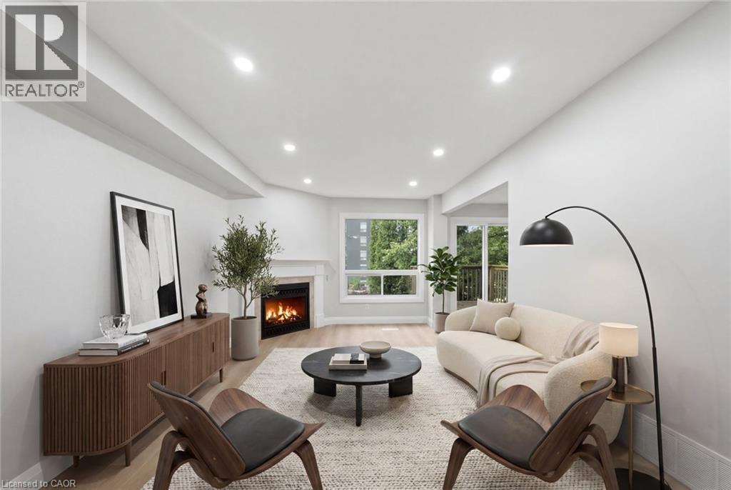 Virtual Staged - 2155 Duncaster Drive Unit# 2, Burlington, ON - Indoor Photo Showing Living Room With Fireplace