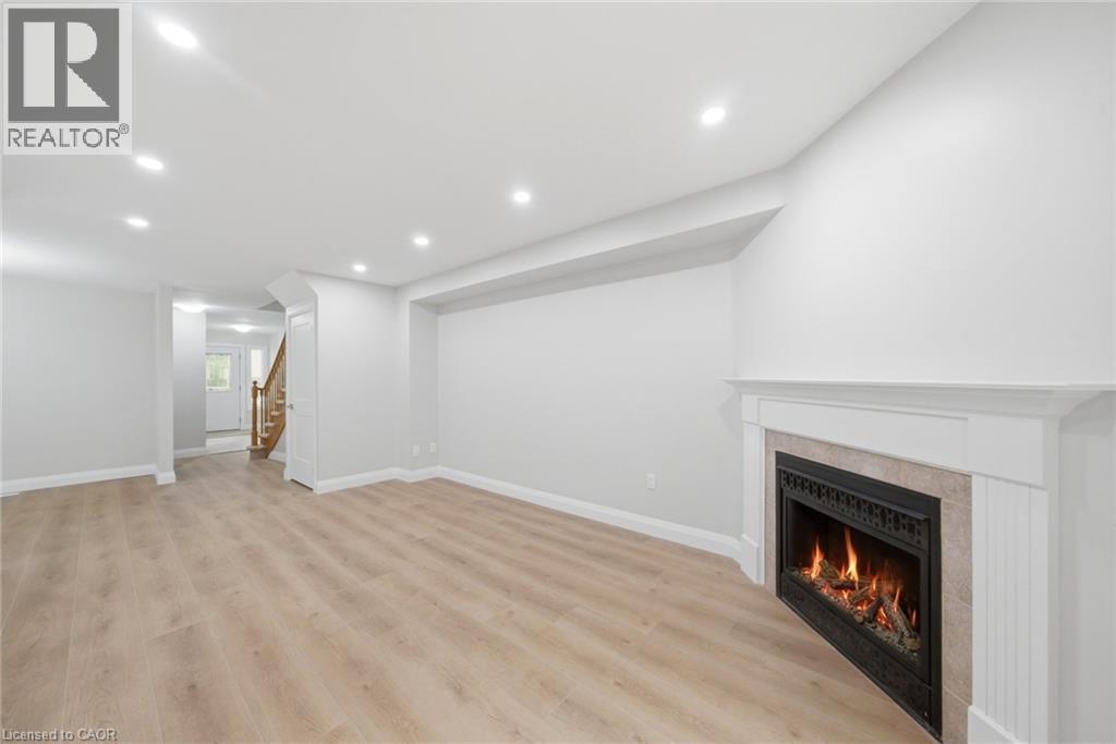 2155 Duncaster Drive Unit# 2, Burlington, ON - Indoor With Fireplace