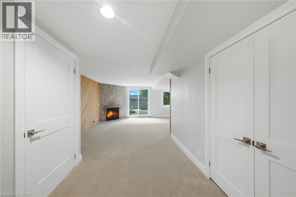 2155 Duncaster Drive Unit# 2, Burlington, ON - Indoor Photo Showing Other Room With Fireplace