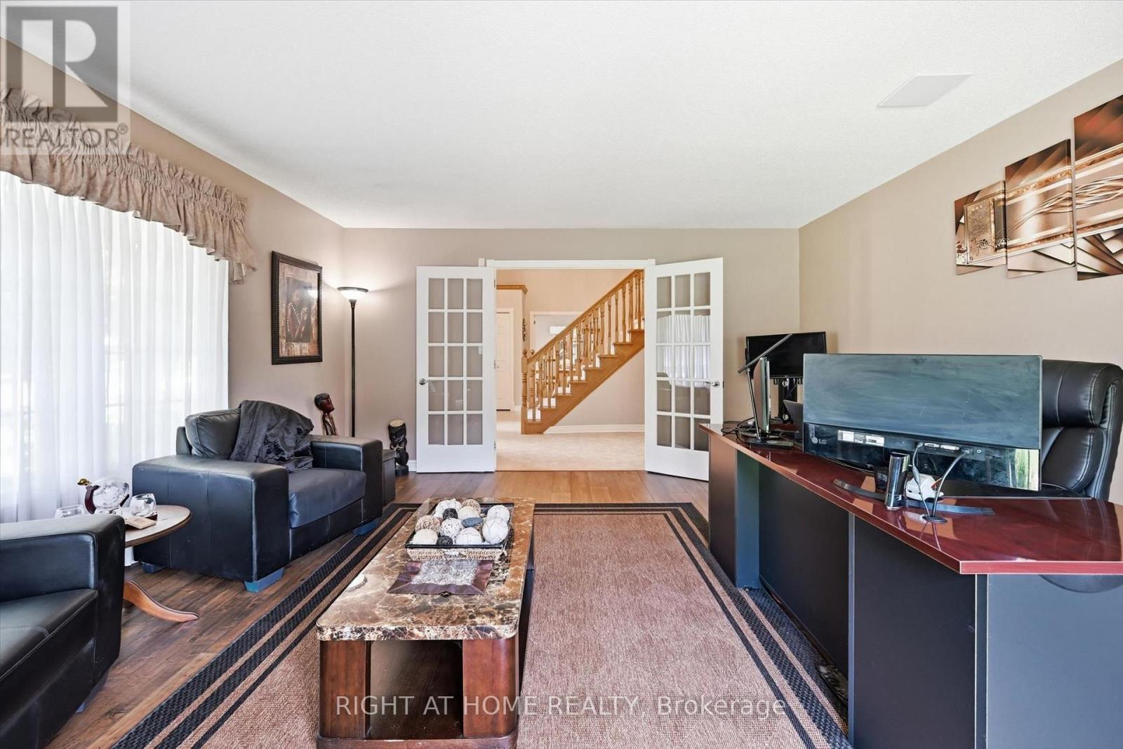 Home office with direct access to rear yard - 1 Idared Road, Hamilton, ON - Indoor Photo Showing Living Room