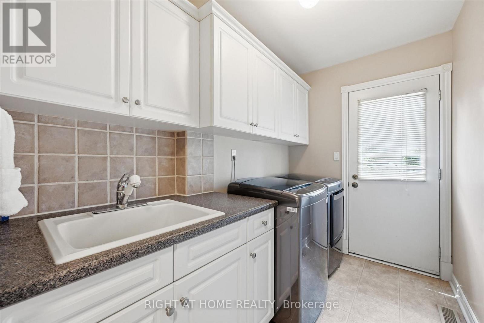 Main Floor Laundry w/ Direct Backyard Access - 1 Idared Road, Hamilton, ON - Indoor Photo Showing Laundry Room