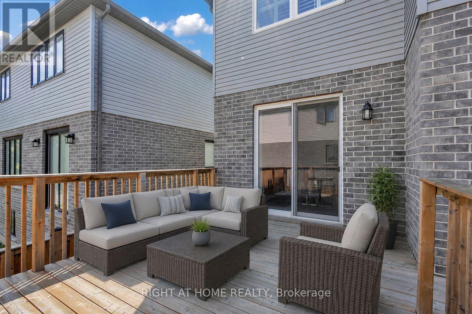 First floor walkout deck(Virtually Staged Photo) - 321 Carriage Way, Waterloo, ON - Outdoor With Deck Patio Veranda With Exterior