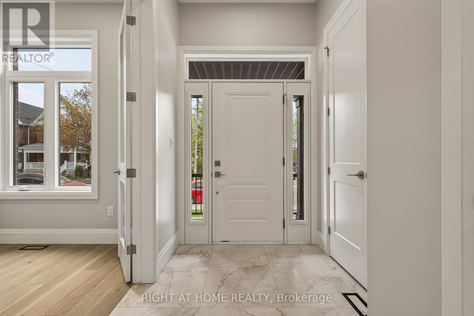 Front door with large entry way to office/den - 279 Hess Street S, Hamilton, ON - Indoor Photo Showing Other Room