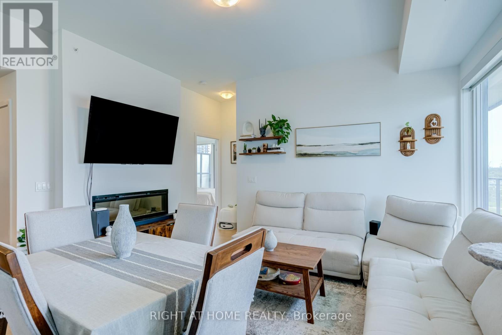 1413 - 30 Shore Breeze Drive, Toronto, ON - Indoor Photo Showing Other Room With Fireplace