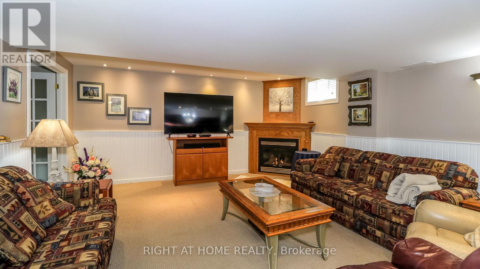 Rec Room/Family Room Gas Fireplace - 36 Benjamin Lane, Barrie, ON - Indoor Photo Showing Living Room With Fireplace