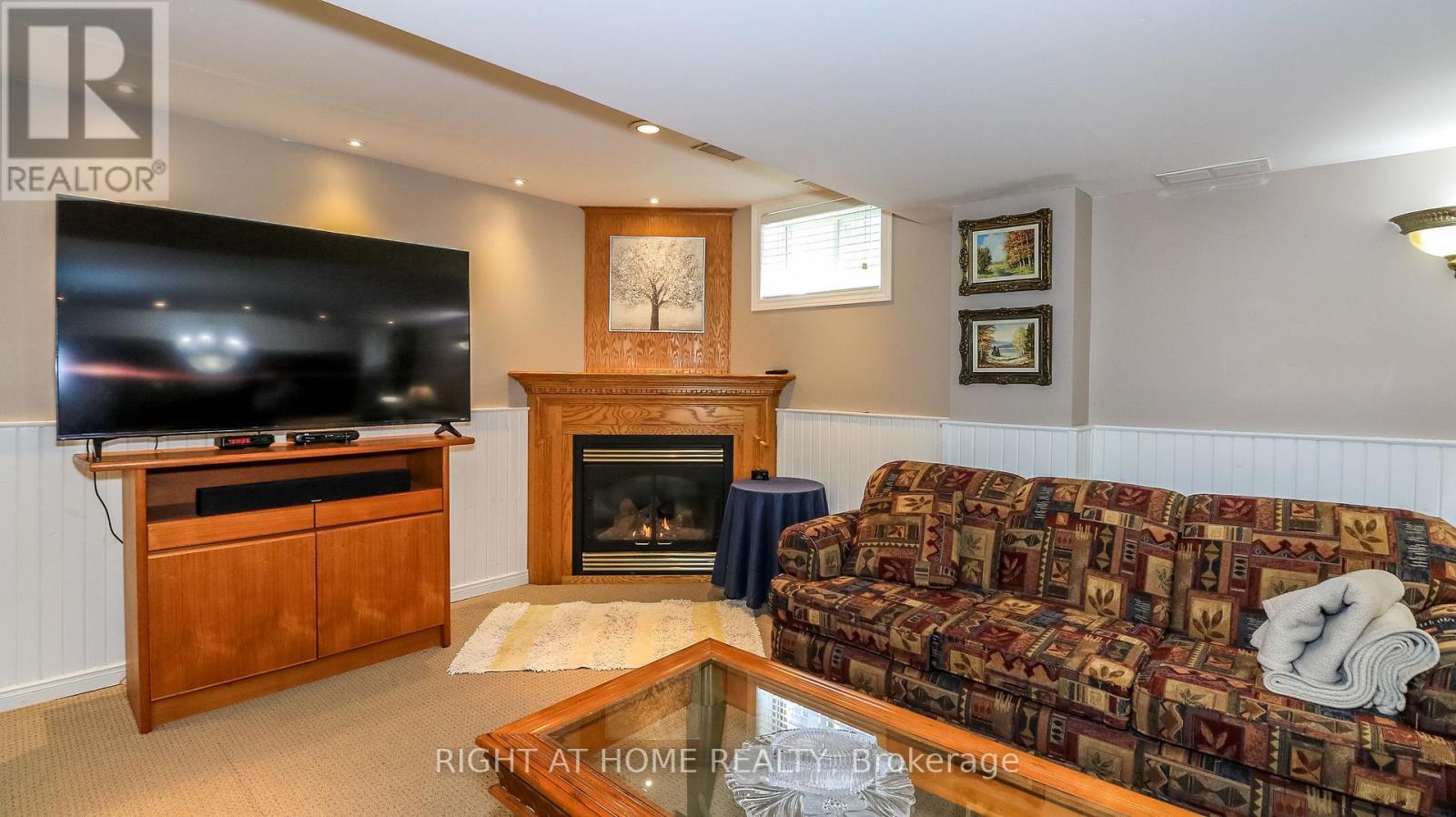 Cozy Family Room - 36 Benjamin Lane, Barrie, ON - Indoor Photo Showing Living Room With Fireplace