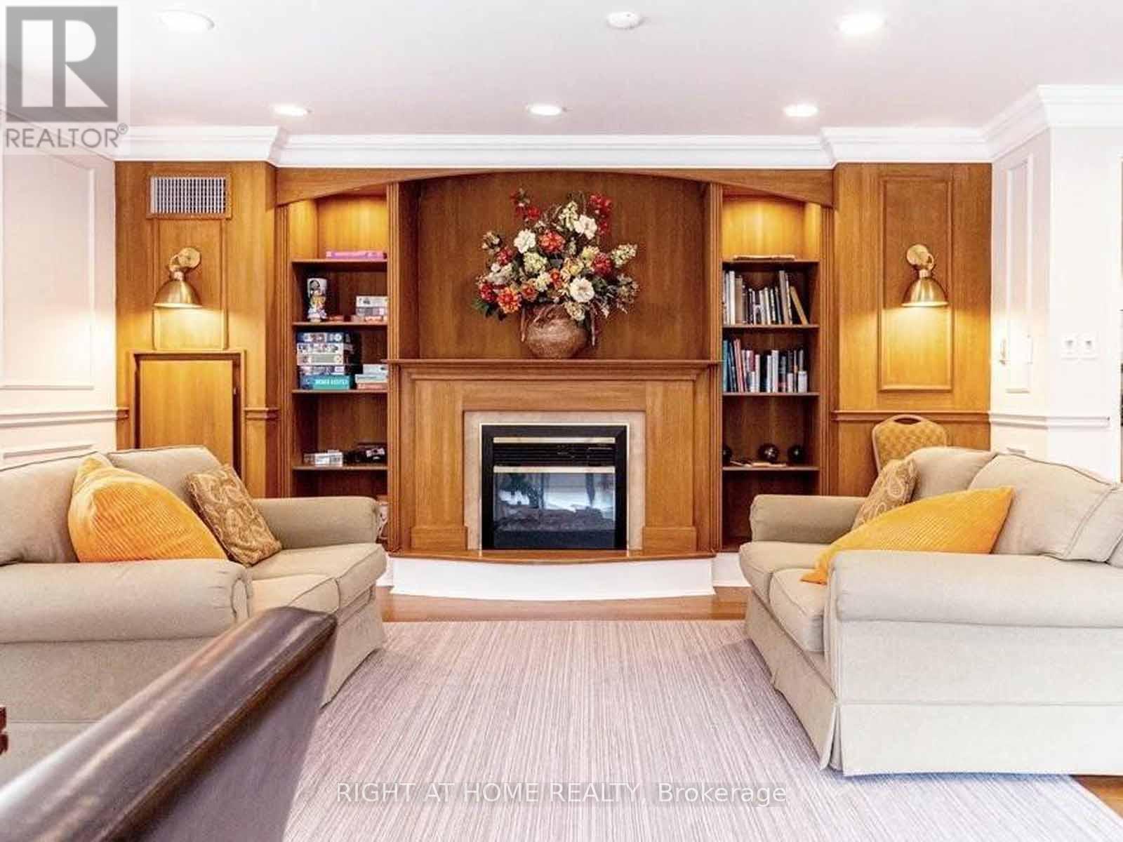 202 - 2000 Creekside Drive, Hamilton, ON - Indoor Photo Showing Living Room With Fireplace