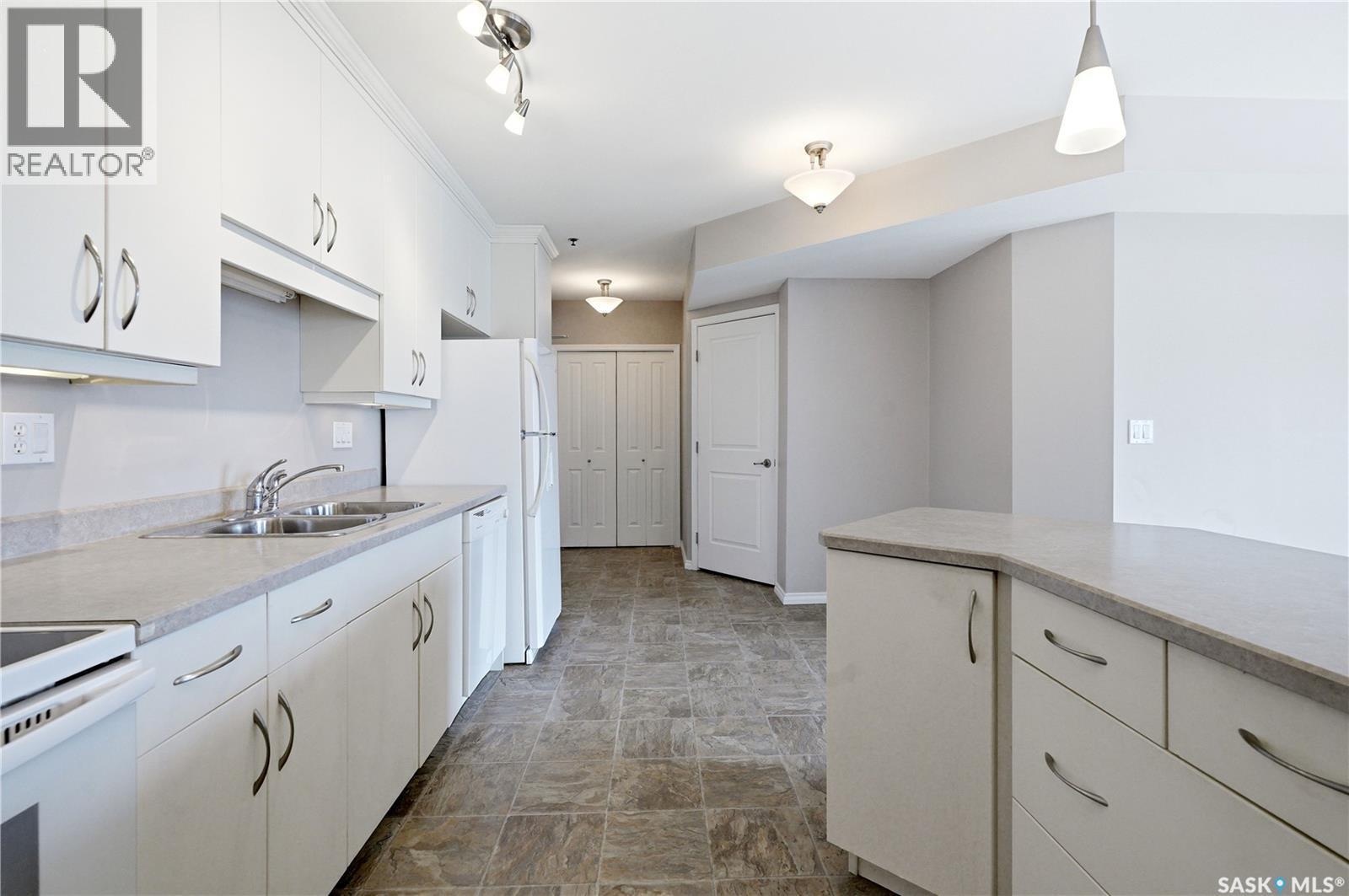 802 902 Spadina Crescent E, Saskatoon, SK - Indoor Photo Showing Kitchen With Double Sink