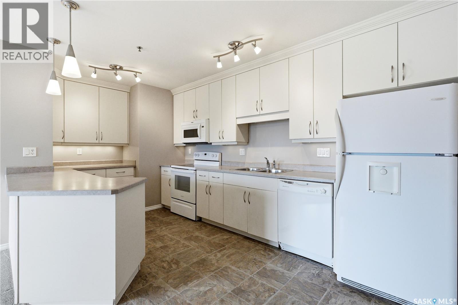 802 902 Spadina Crescent E, Saskatoon, SK - Indoor Photo Showing Kitchen With Double Sink