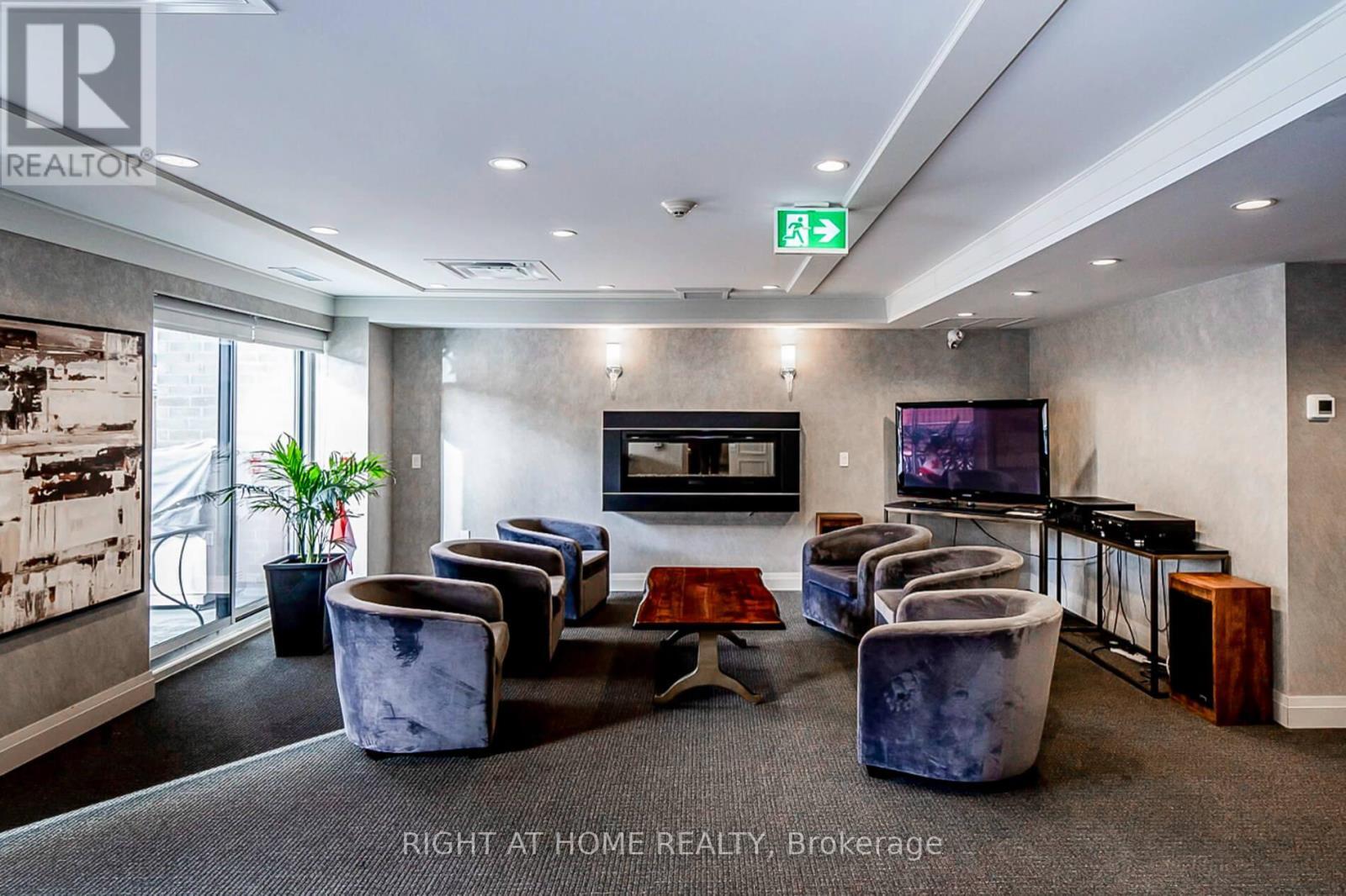 318 - 40 Via Rosedale, Brampton, ON - Indoor With Fireplace