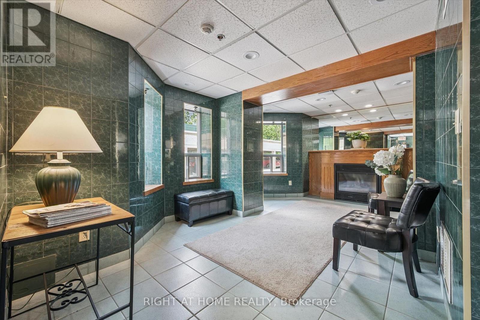 804 - 281 Bristol Street, Guelph, ON - Indoor Photo Showing Other Room With Fireplace