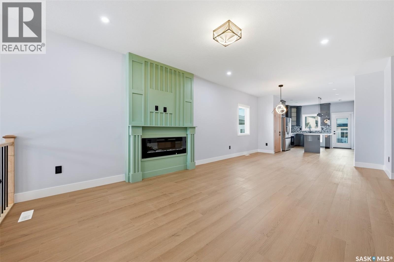 150 Sharma Lane, Saskatoon, SK - Indoor Photo Showing Living Room With Fireplace