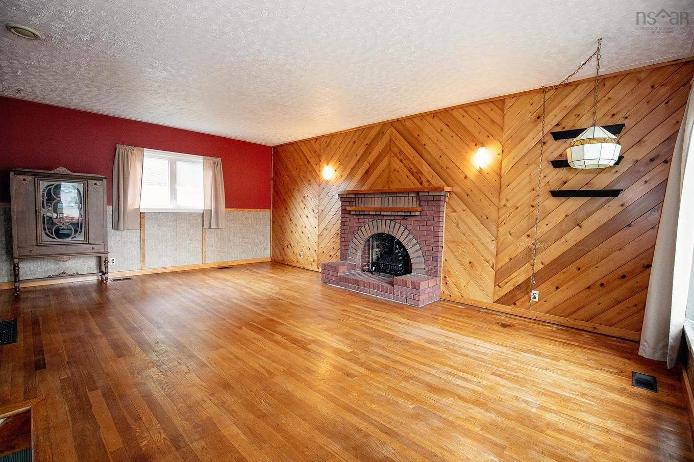 8 Allison Avenue, Amherst, NS - Indoor Photo Showing Living Room With Fireplace
