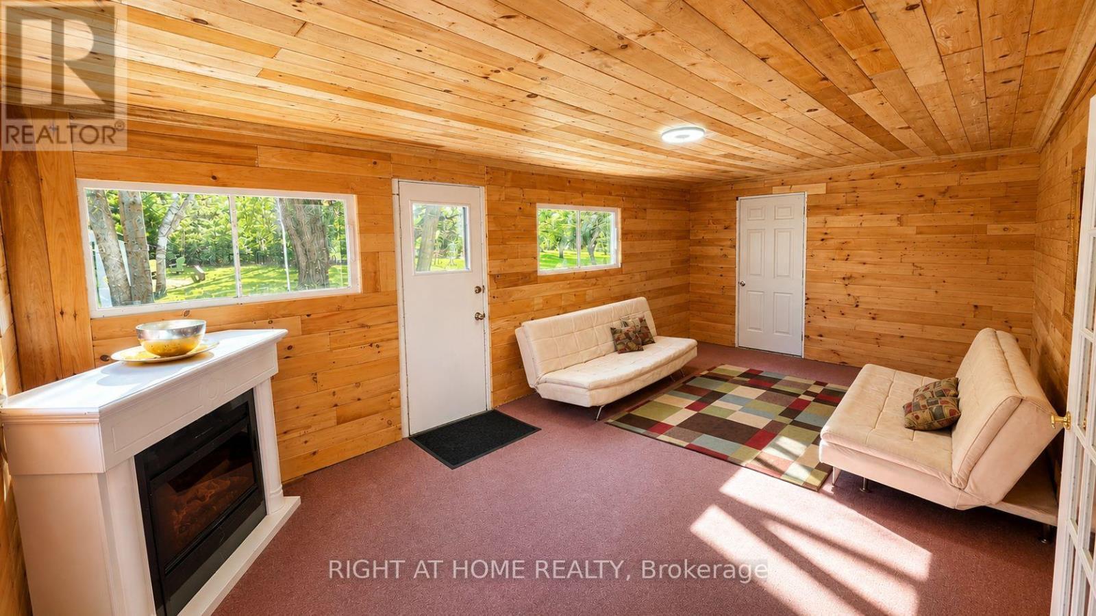 640 Tiny Beaches Road N, Tiny, ON - Indoor With Fireplace