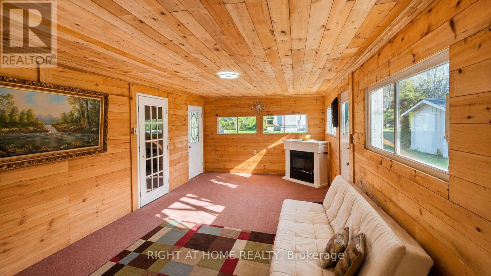 640 Tiny Beaches Road N, Tiny, ON - Indoor With Fireplace