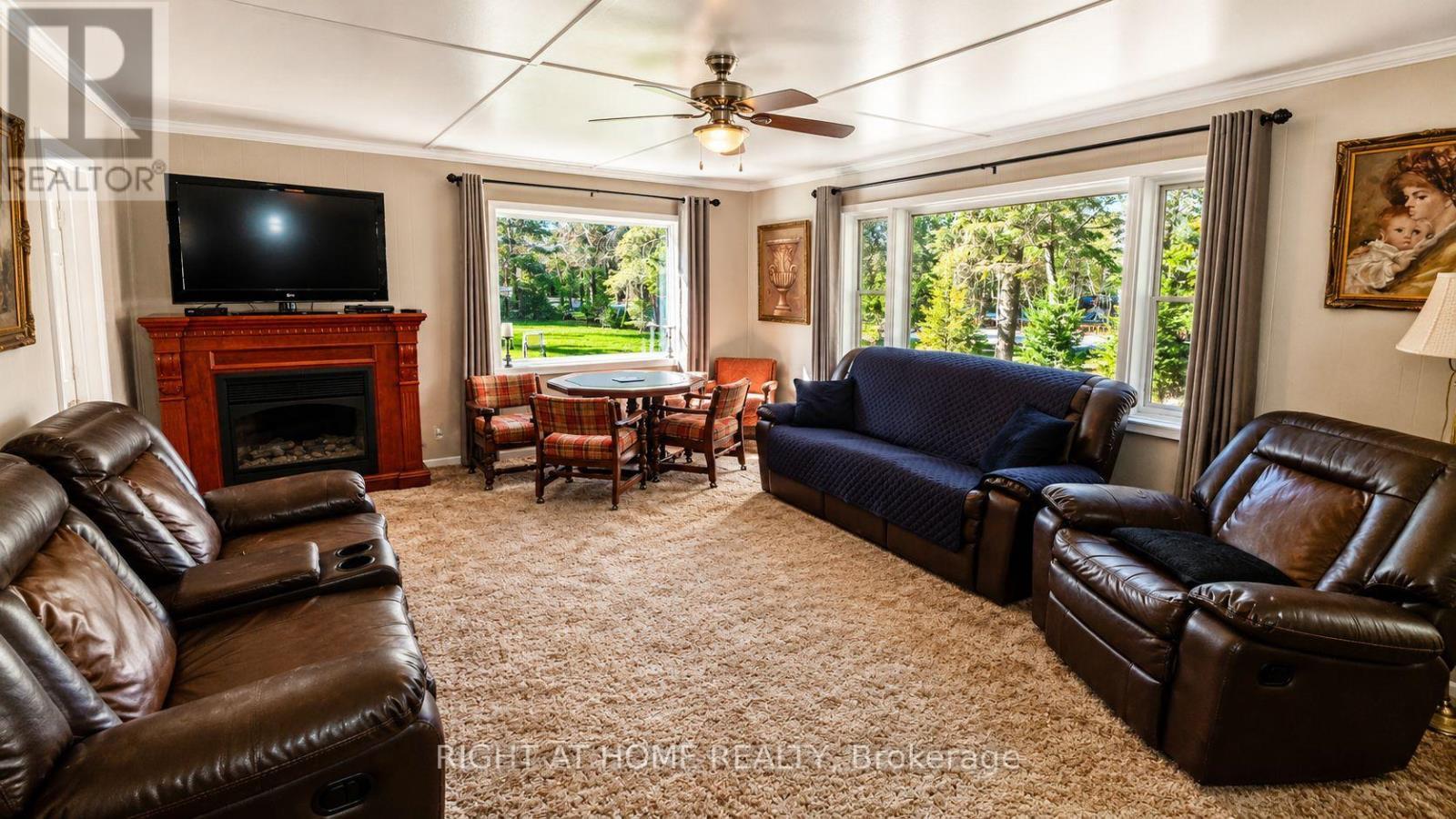 640 Tiny Beaches Road N, Tiny, ON - Indoor Photo Showing Living Room With Fireplace